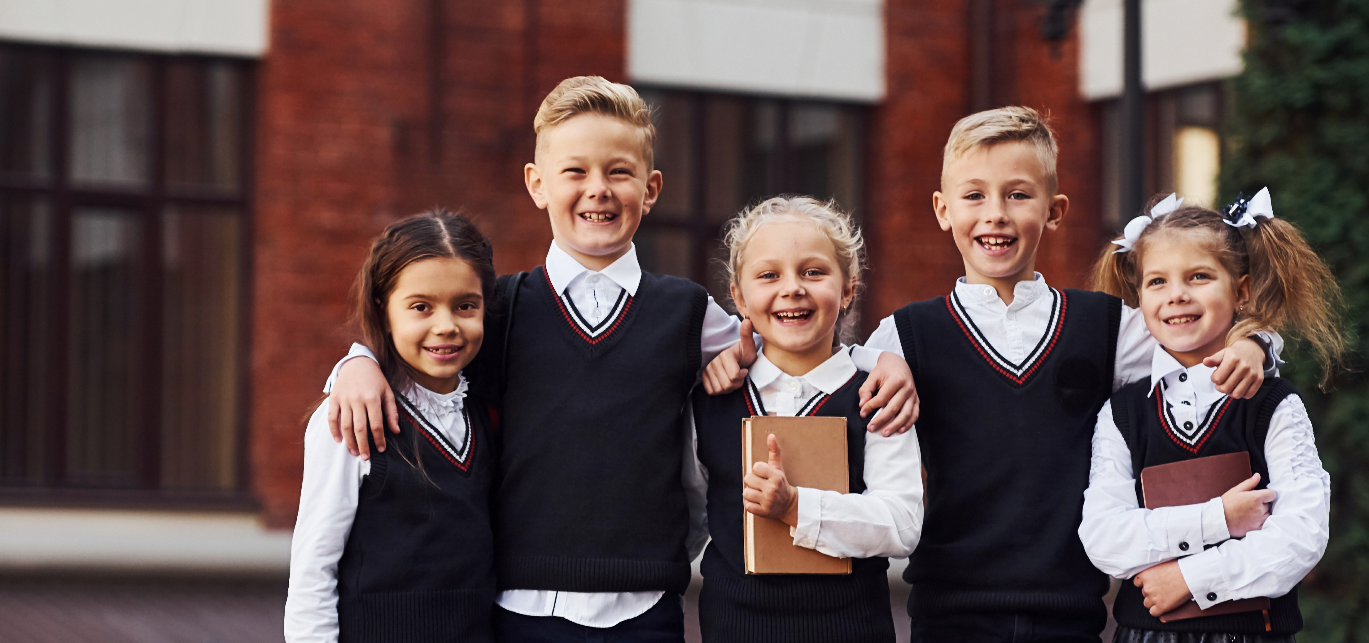 group-of-kids-in-school-uniform-that-is-outdoors-t-XXWHJQS-1 group-of-kids-in-school-uniform-that-is-outdoors-t-XXWHJQS-1